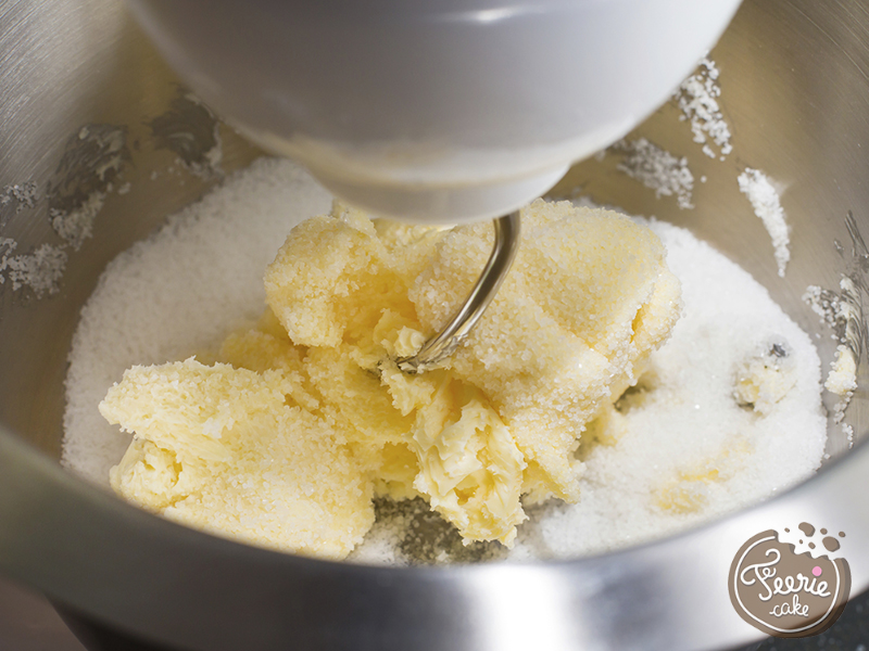 Mixing butter and sugar in mixing machine, homemade bakery, close up